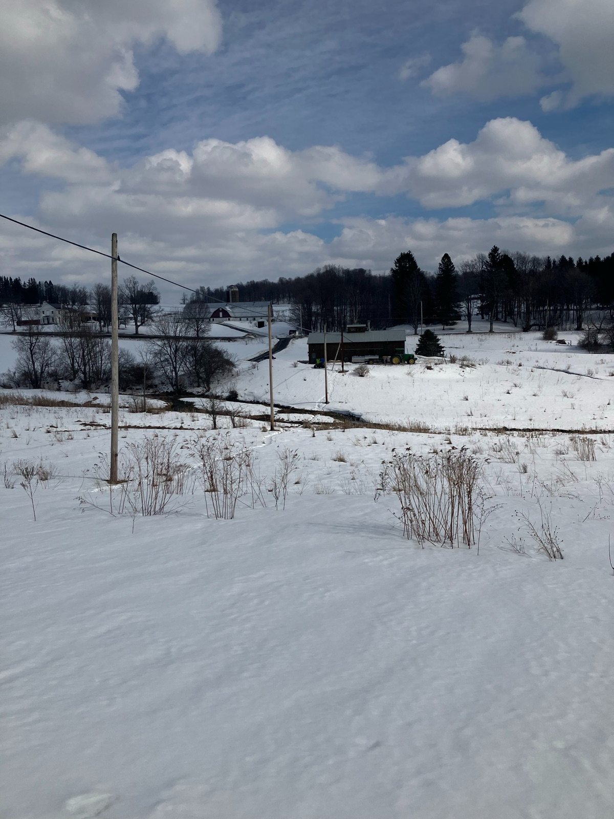 Our sugarhouse across the snowy fields in early spring